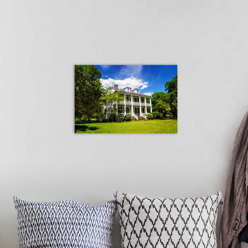 A bohemian room featuring Photograph of the front of Hopsewee Plantation in South Carolina.