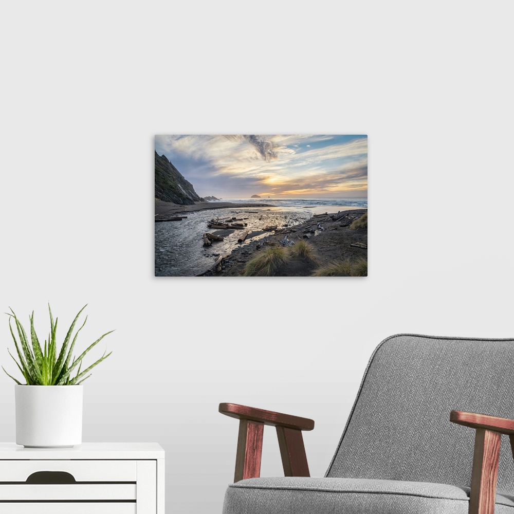 A modern room featuring Landscape photograph of a sunrise over the water at Humbug Mountain State Park in Oregon.