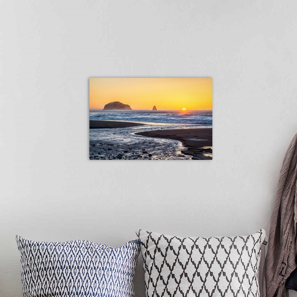 A bohemian room featuring Landscape photograph of the rocky beach at Humbug Mountain State Park with the sun setting right ...