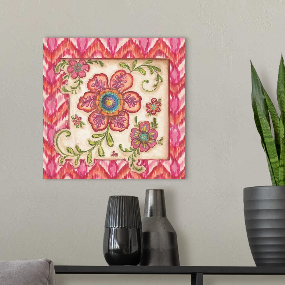 A modern room featuring Square painting of colorful flowers with an ikat designed frame in shades of pink.