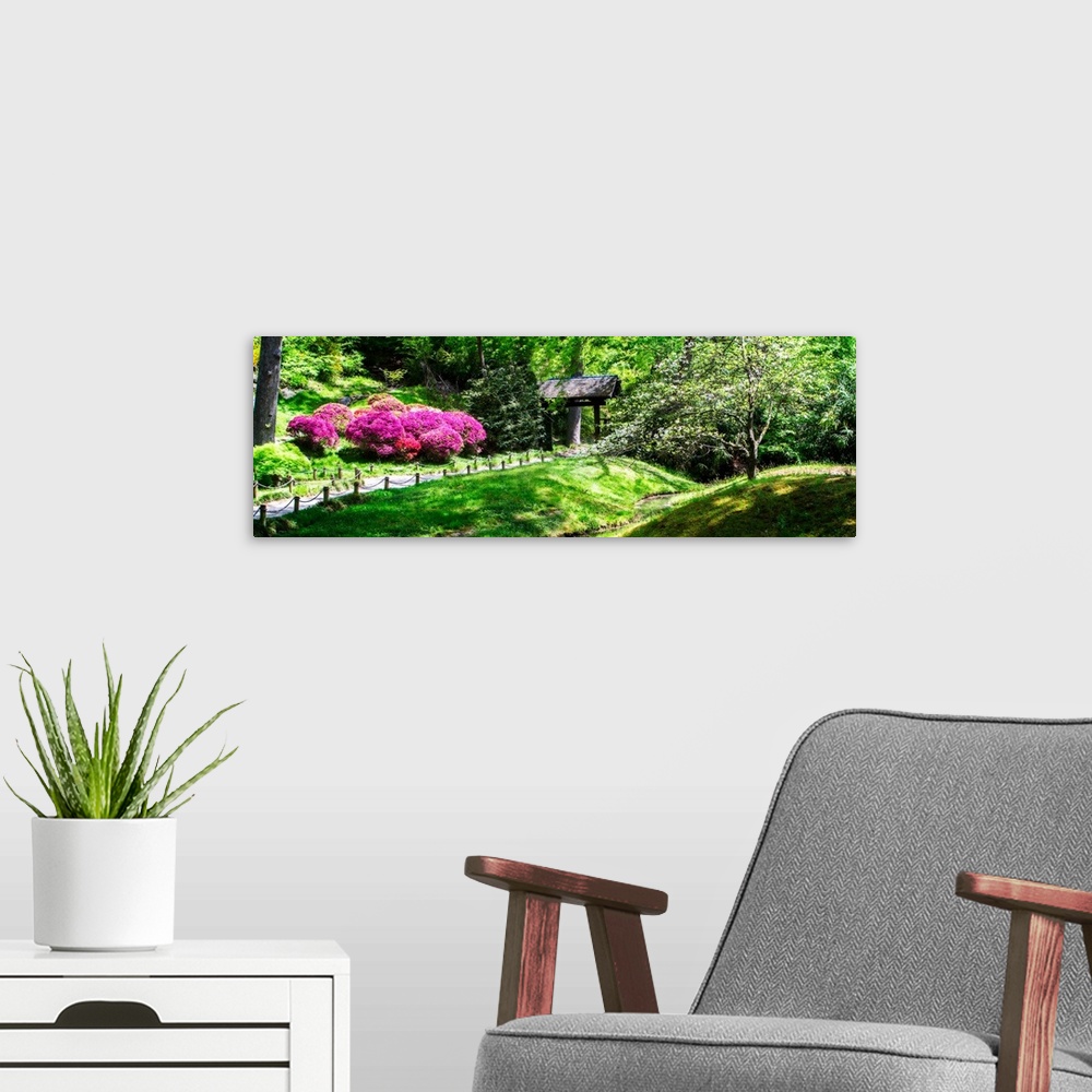 A modern room featuring Panoramic photograph of a Japanese garden with bright pink and purple flowers and lush greenery.