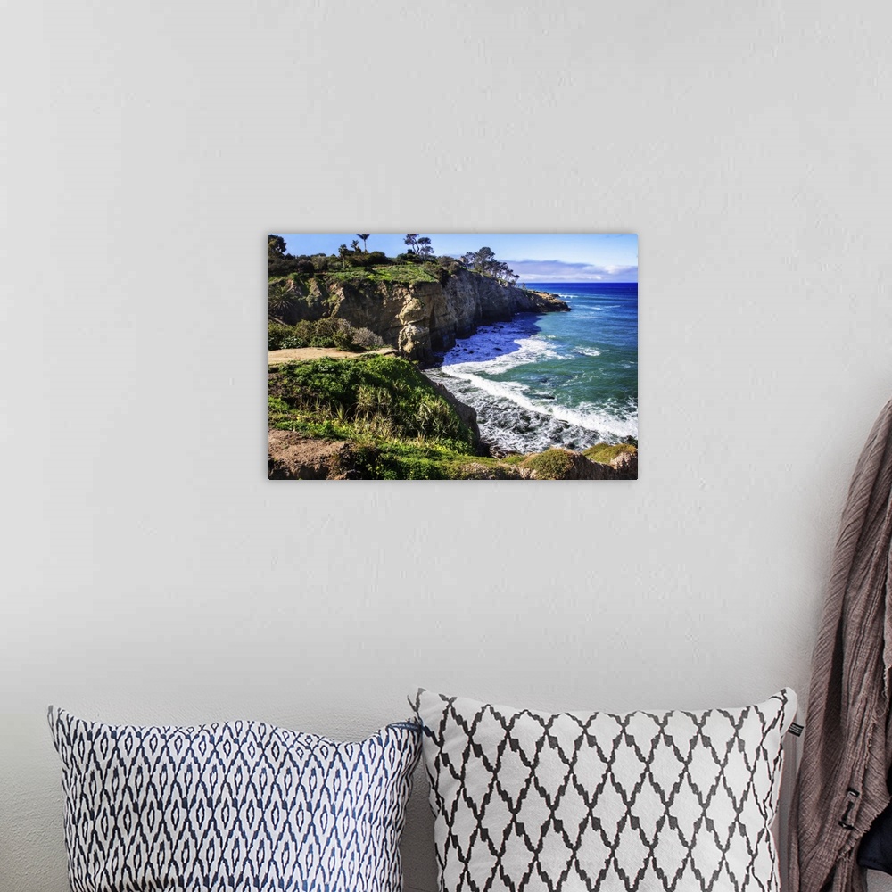 A bohemian room featuring Landscape photograph of the cliffs on the coast line in La Jolla, California.