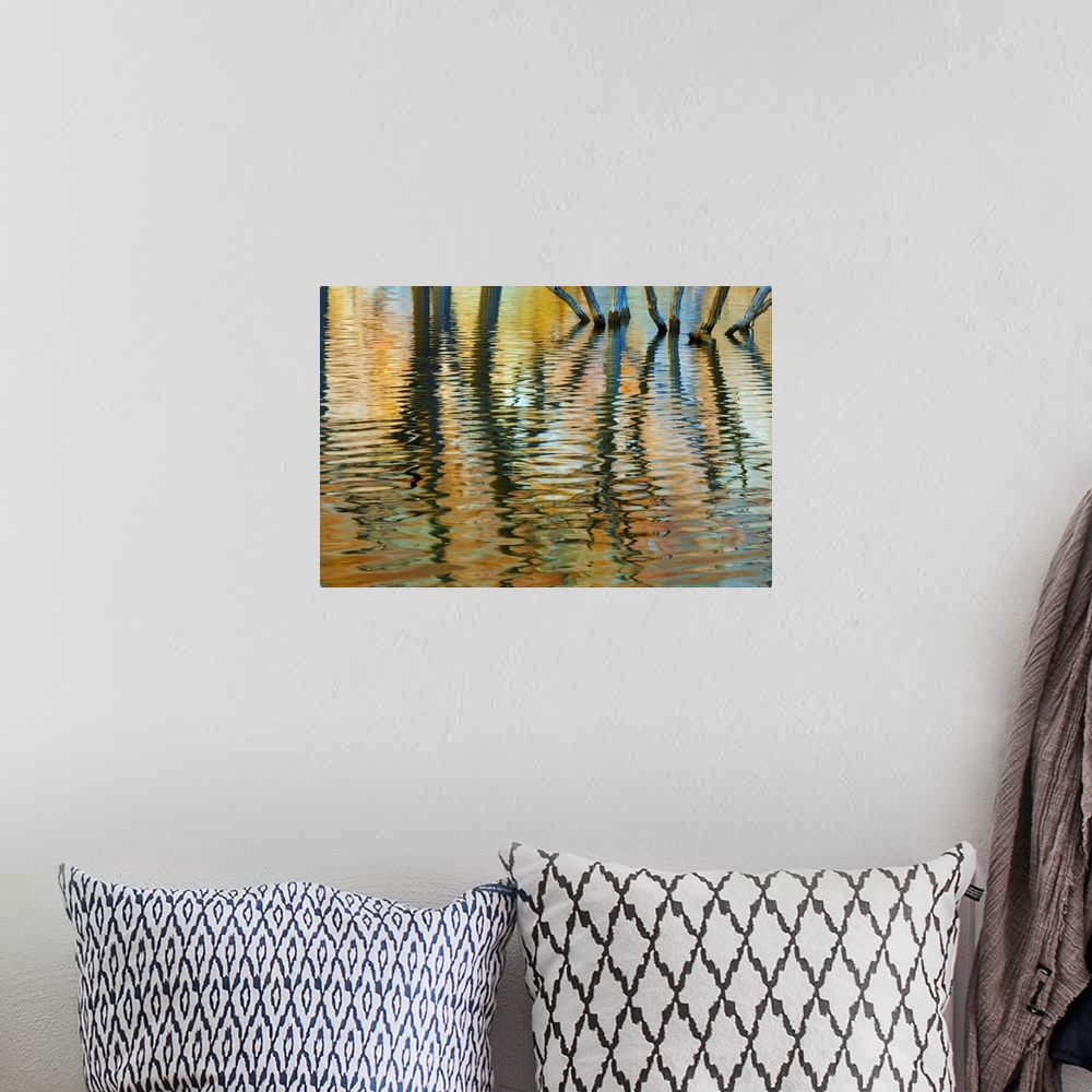 A bohemian room featuring An abstract photograph created by natural reflections in rippling water.