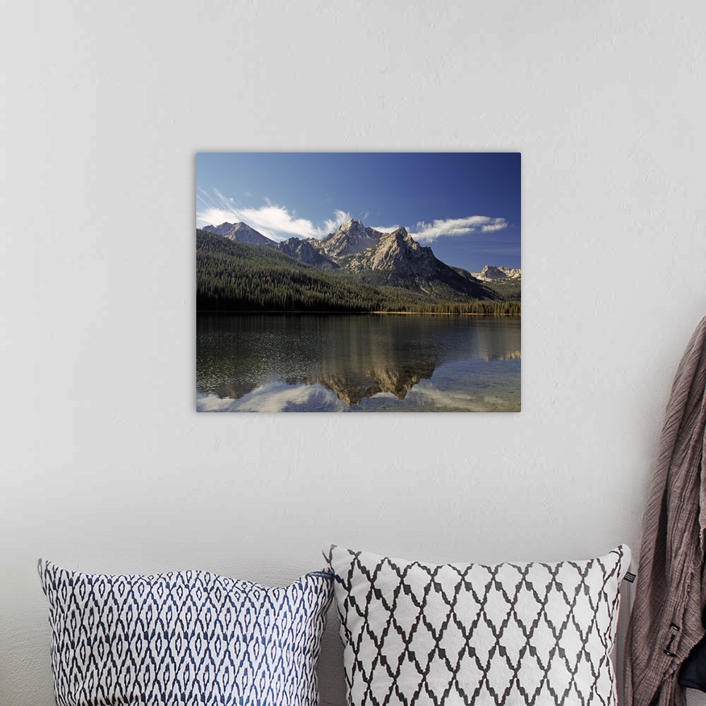 A bohemian room featuring Landscape photograph of Lake Stanley with the mountains in the distance reflecting onto the water...