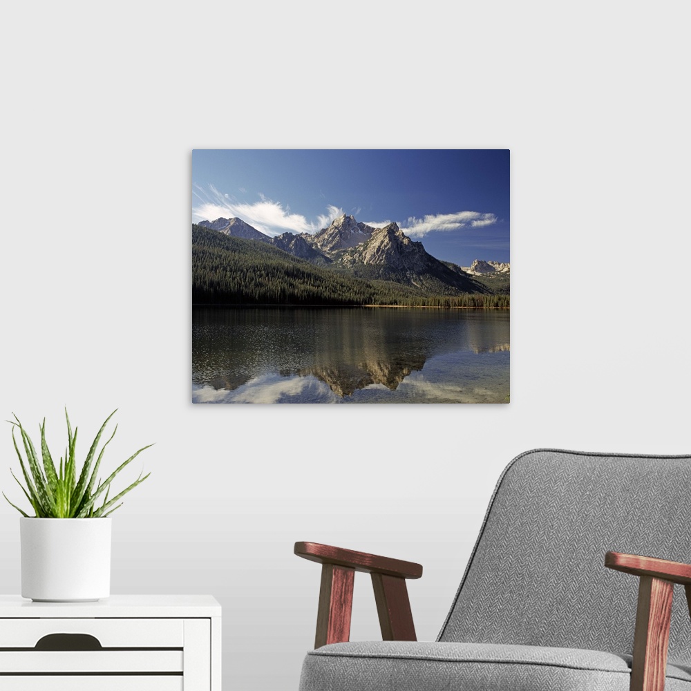 A modern room featuring Landscape photograph of Lake Stanley with the mountains in the distance reflecting onto the water...