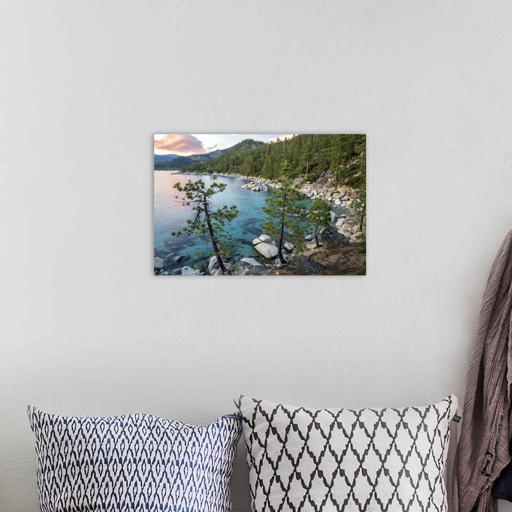 A bohemian room featuring Landscape photograph of Lake Tahoe with clear blue water at sunset.