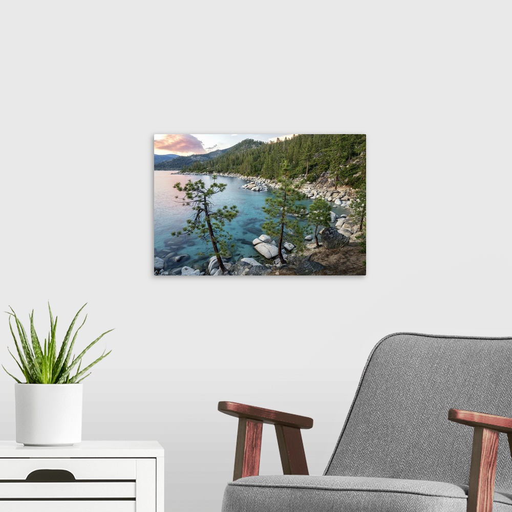 A modern room featuring Landscape photograph of Lake Tahoe with clear blue water at sunset.