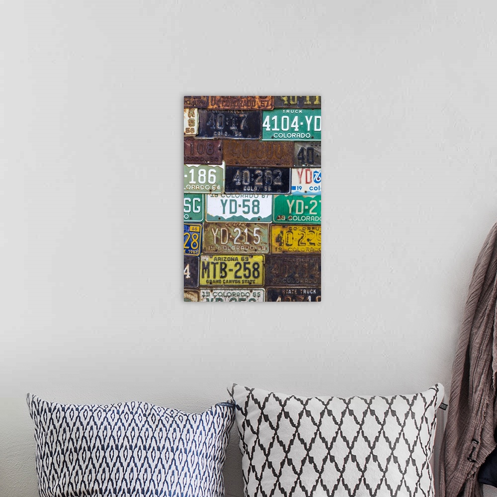 A bohemian room featuring A collection of vintage license plates.