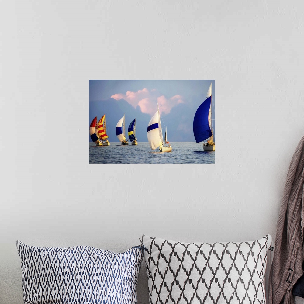 A bohemian room featuring A regatta of colorful sailboats with a cloudy sky.