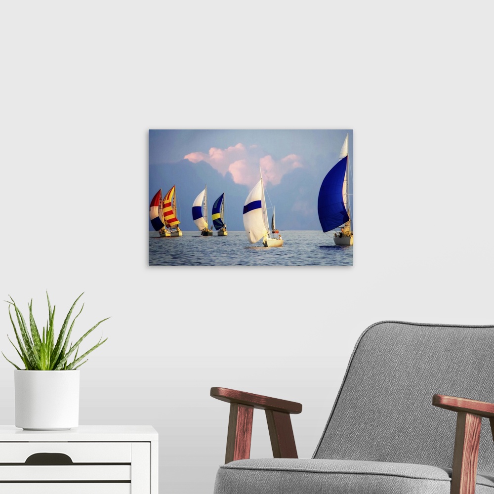 A modern room featuring A regatta of colorful sailboats with a cloudy sky.