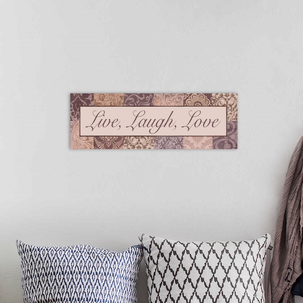 A bohemian room featuring "Live, Laugh, Love"in shades of pink and purple