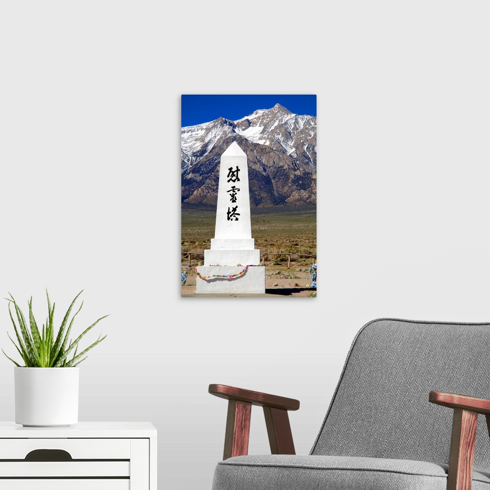 A modern room featuring Photograph of the Manzanar Remembrance monument with the Sierra Nevadas in the background.