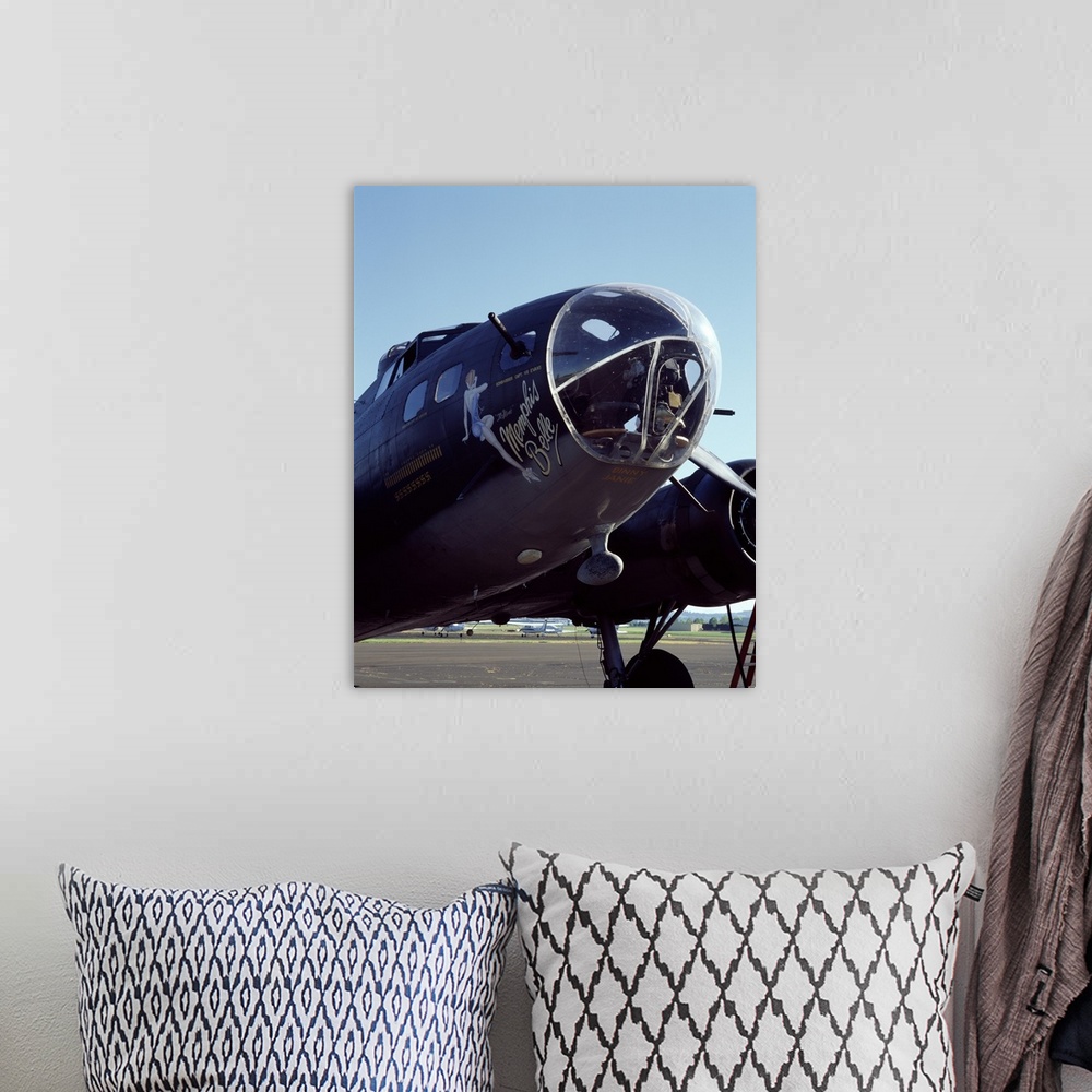 A bohemian room featuring Photograph of the front end of the Memphis Belle aircraft.