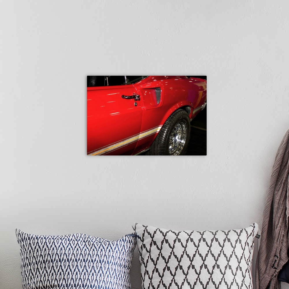 A bohemian room featuring Fine art photograph of the door and back wheel of a vintage car.