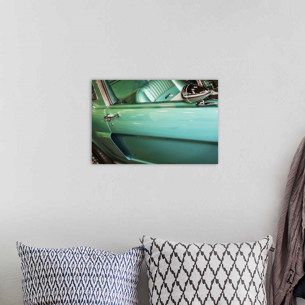 A bohemian room featuring Fine art photograph of the door and back wheel of a vintage car.