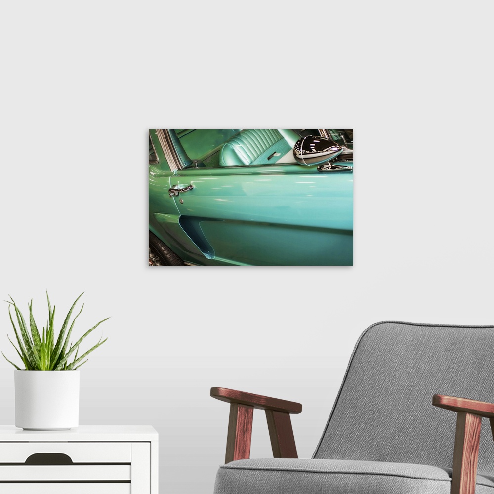 A modern room featuring Fine art photograph of the door and back wheel of a vintage car.