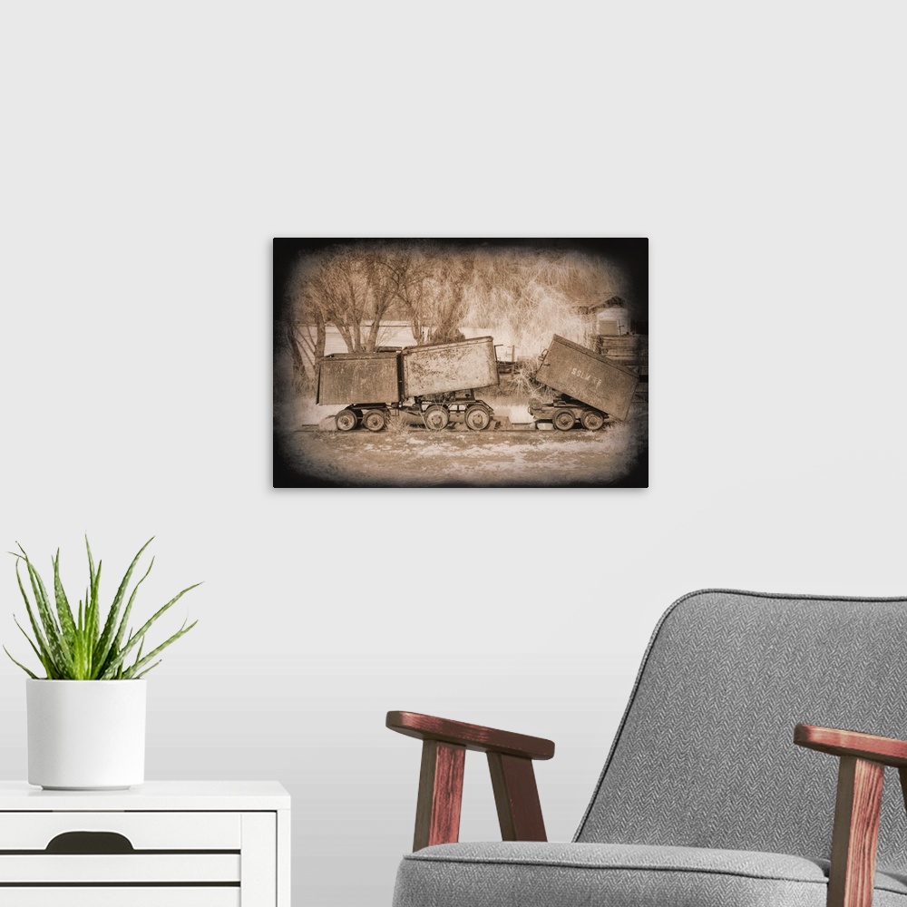 A modern room featuring Antique photograph of mine carts with a dark vignette.