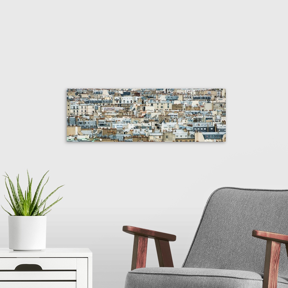 A modern room featuring Panoramic view of the buildings in the region of Montmartre, France.
