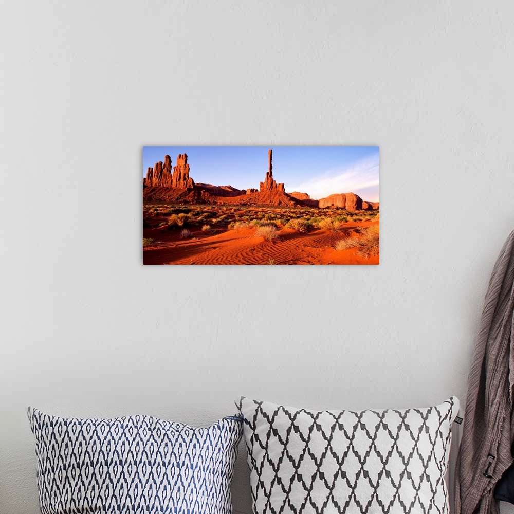A bohemian room featuring The bright red sands and rock formations of Monument Valley, Arizona.