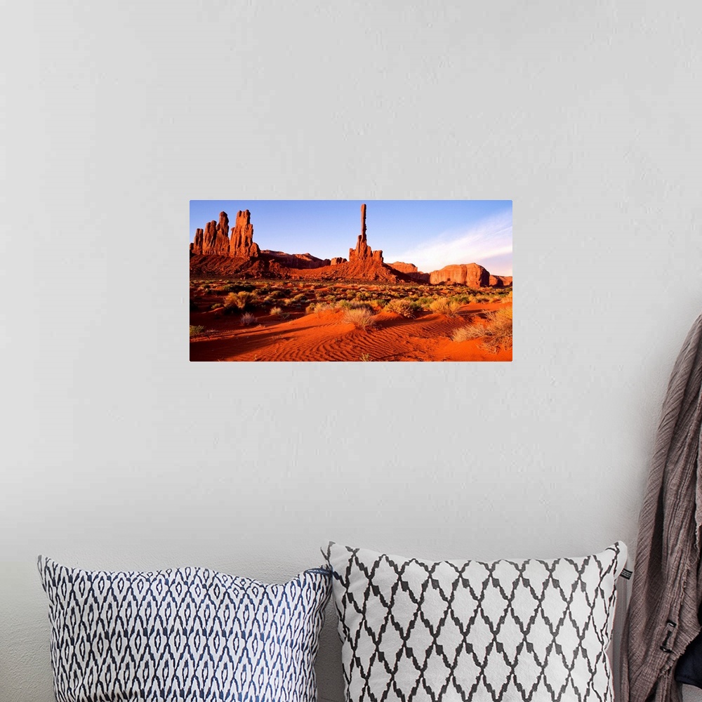 A bohemian room featuring The bright red sands and rock formations of Monument Valley, Arizona.
