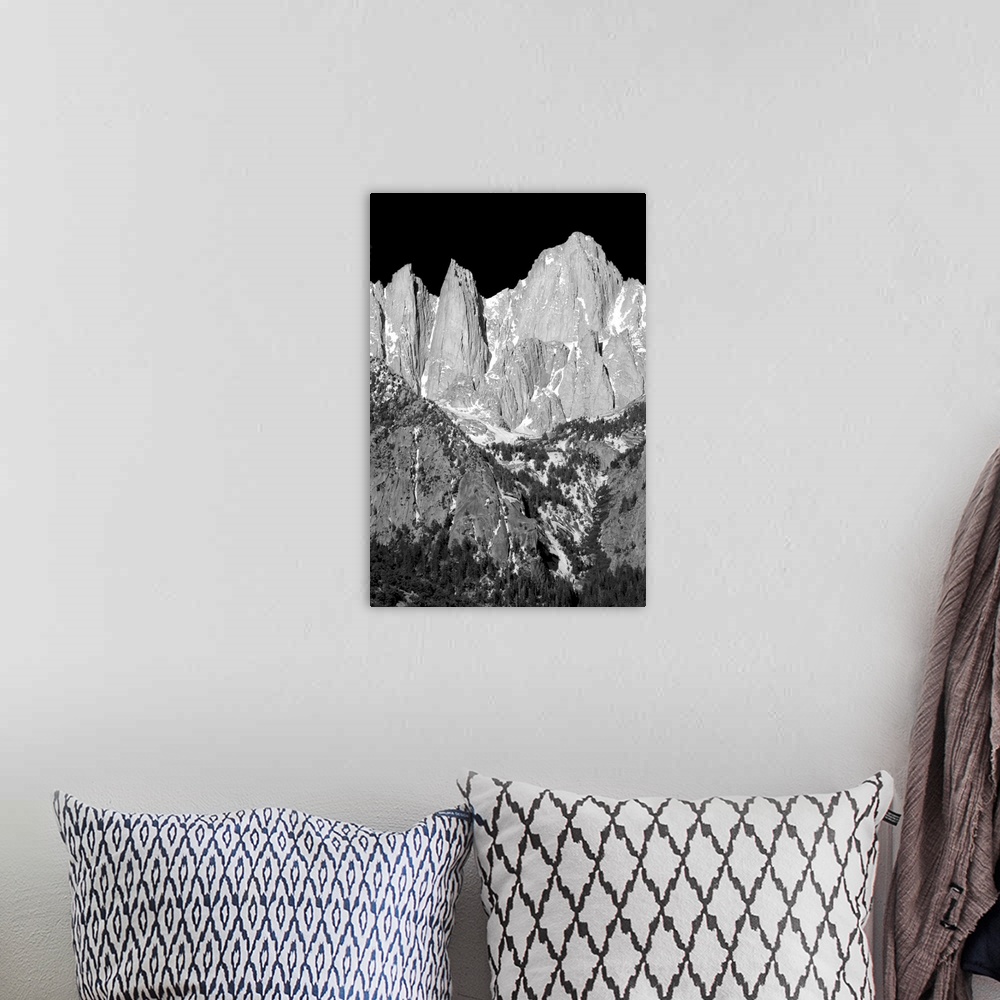 A bohemian room featuring Black and white landscape photograph of Mount Whitney highlighting its rocky textures.
