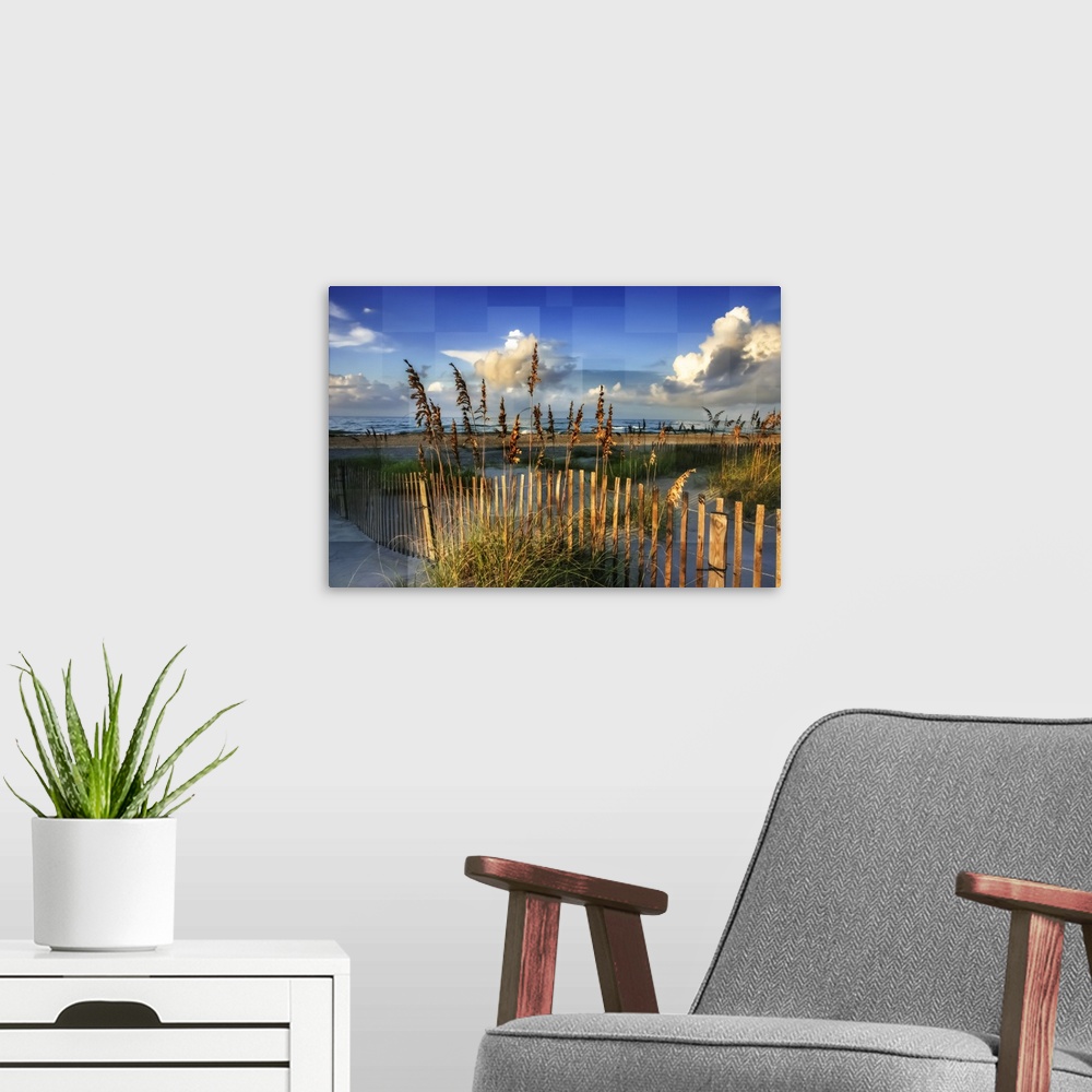 A modern room featuring Reeds along a fence on the beach, with square shapes in the sky.