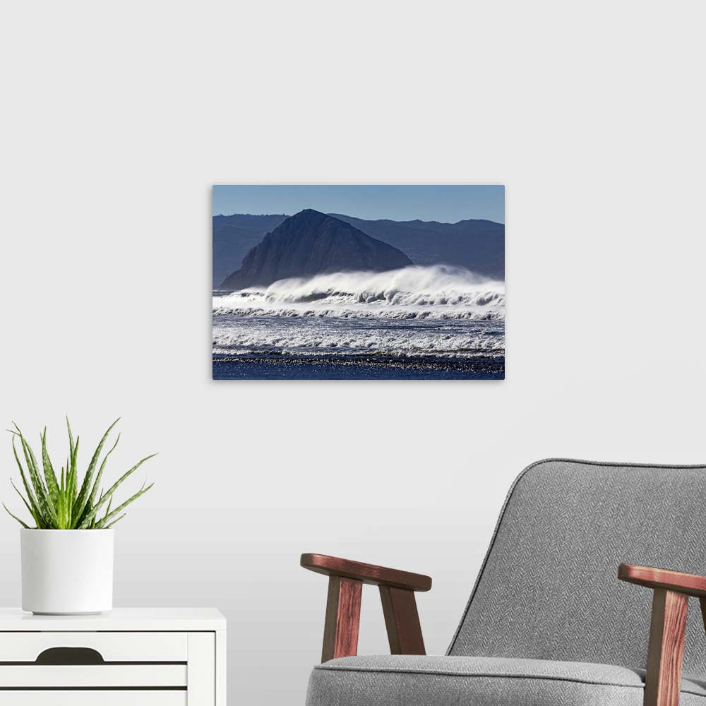A modern room featuring Photograph of big dramatic surf crashing over rocks in Morro Bay, California.