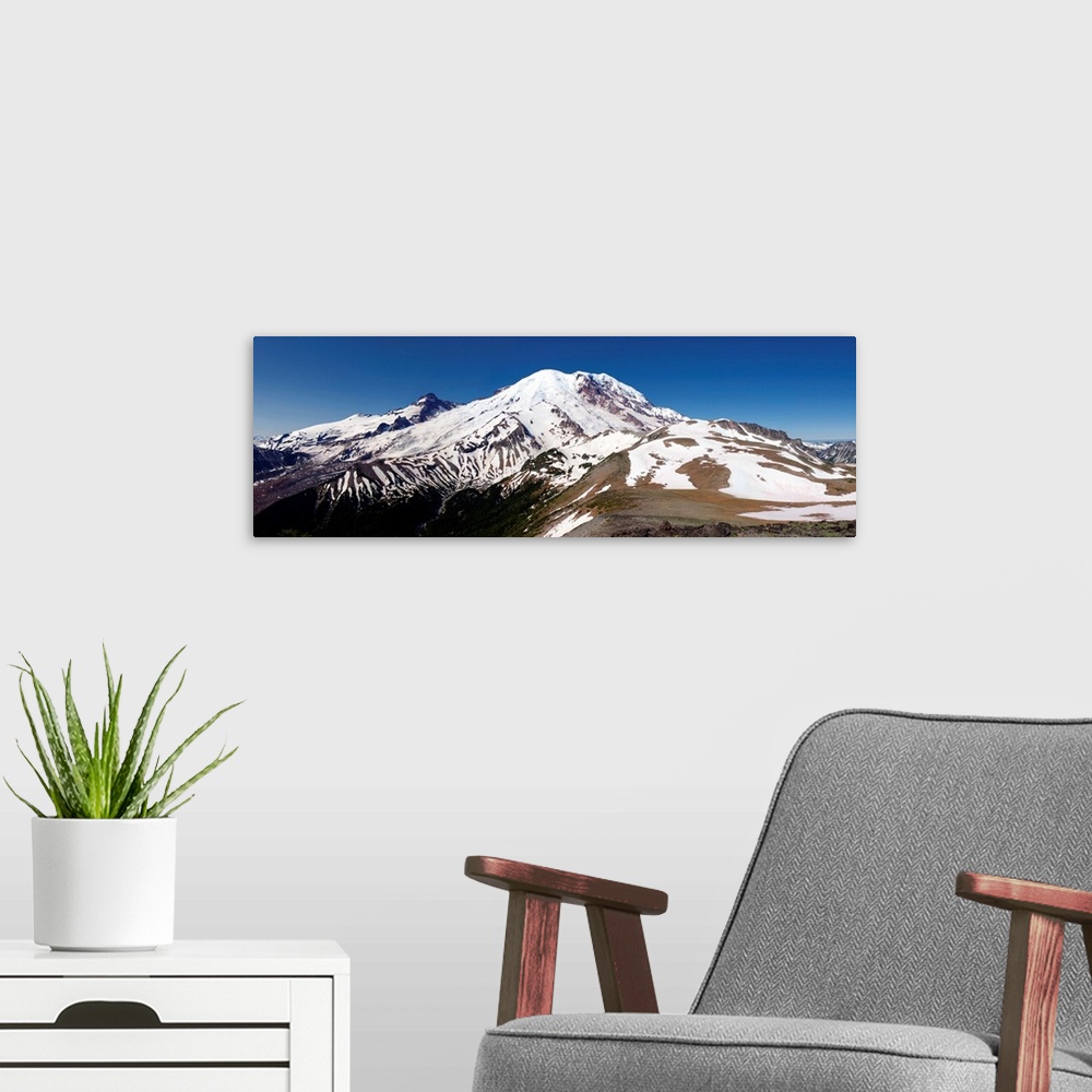 A modern room featuring Panoramic view of the snowy peak of Mount Rainier.
