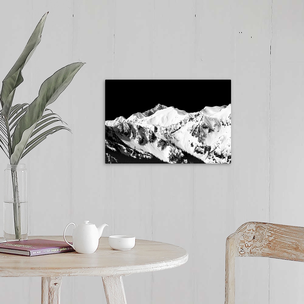 A farmhouse room featuring Black and white photograph of snowy mountain peaks.