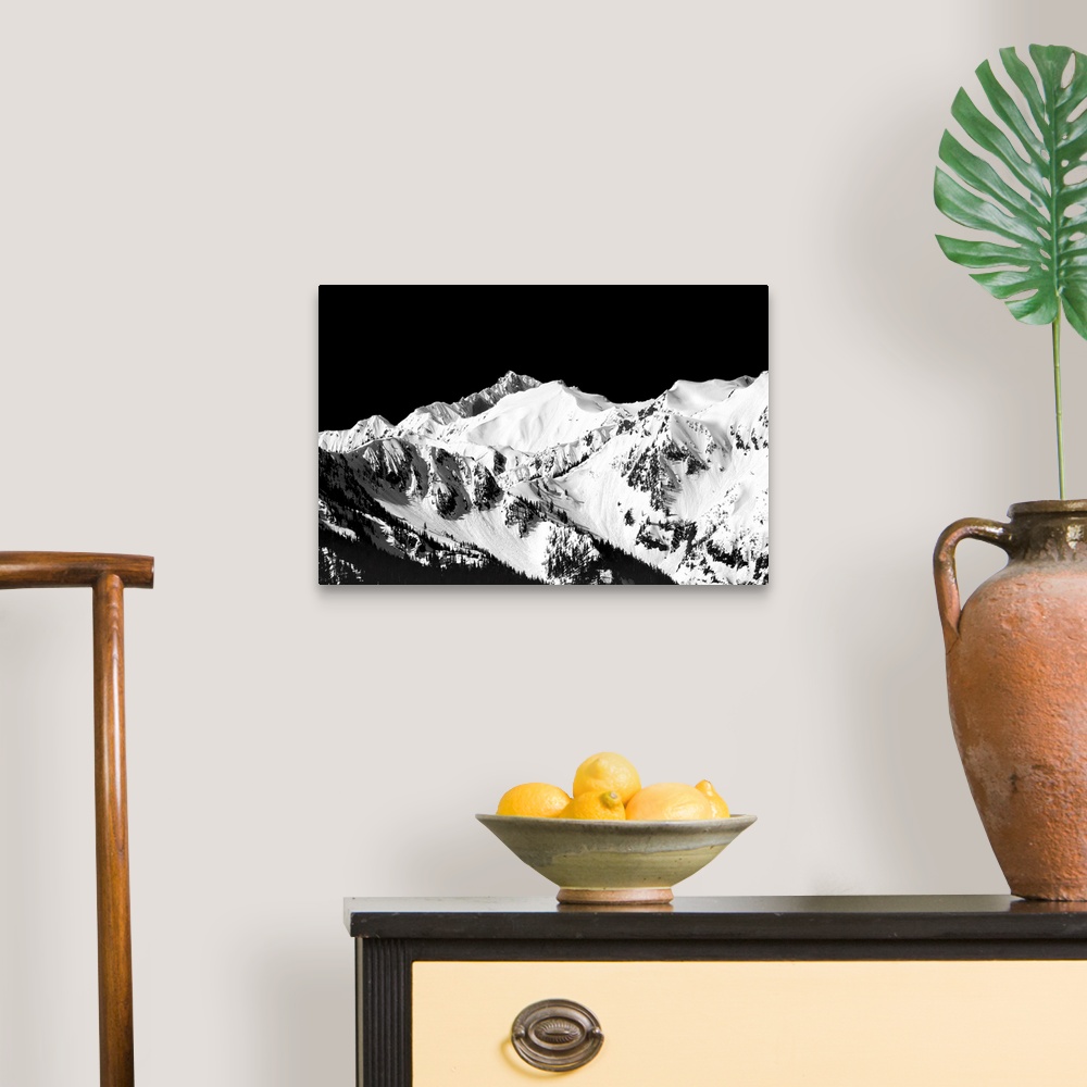 A traditional room featuring Black and white photograph of snowy mountain peaks.