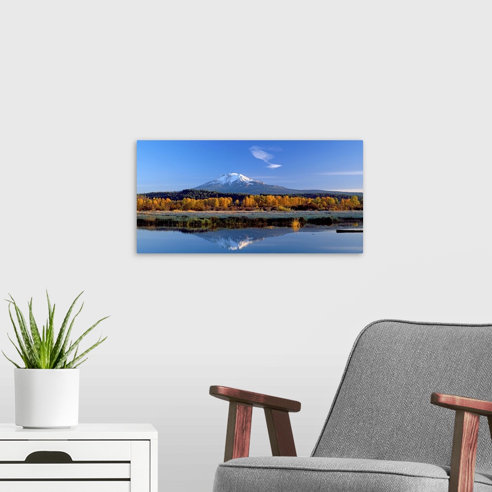 A modern room featuring View of the peak of Mount Adams in Washington, reflected in the water.