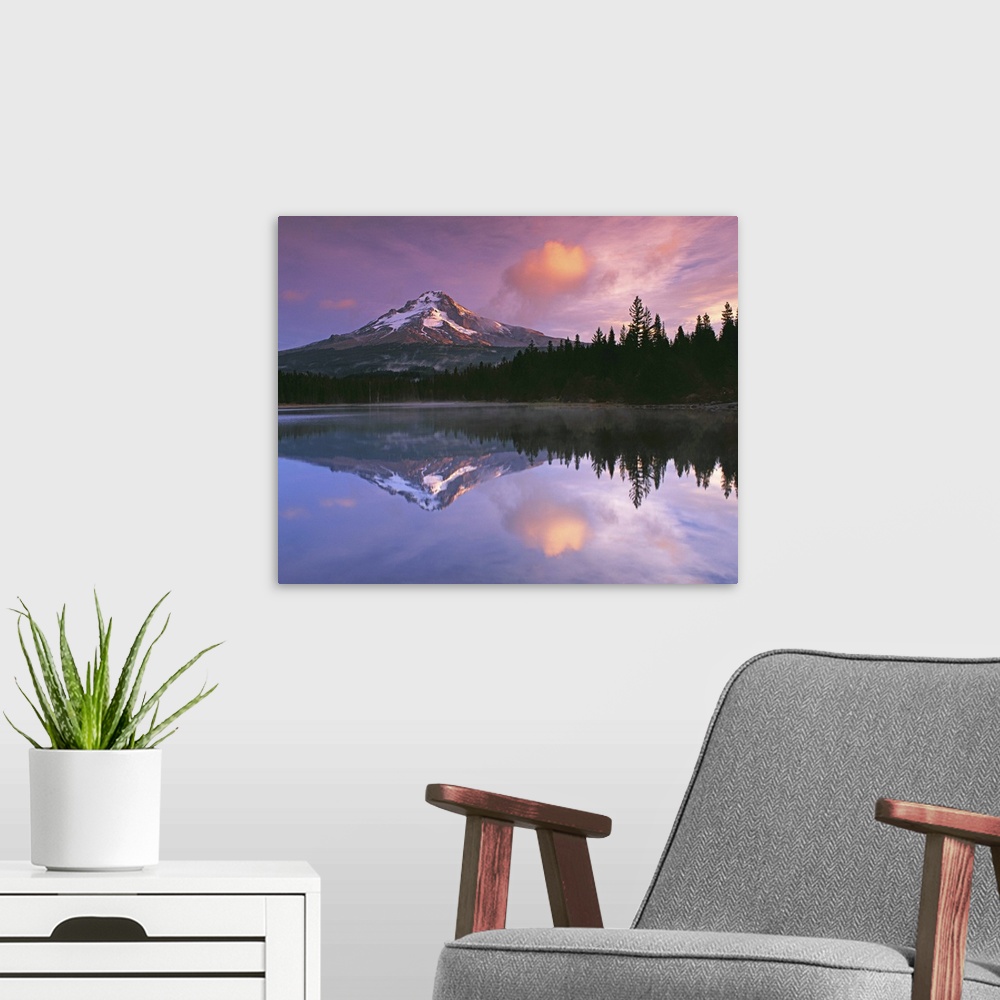 A modern room featuring Mount Hood and the surrounding forests reflected in a lake, Oregon.