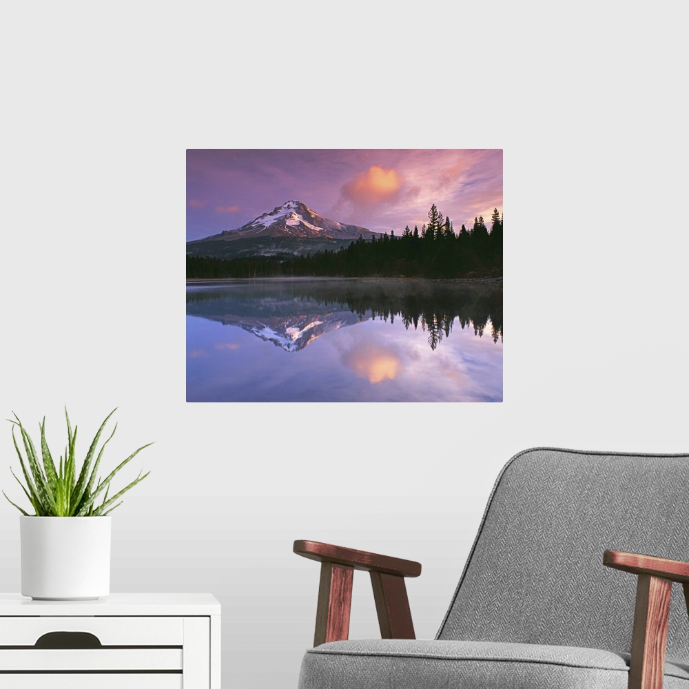 A modern room featuring Mount Hood and the surrounding forests reflected in a lake, Oregon.