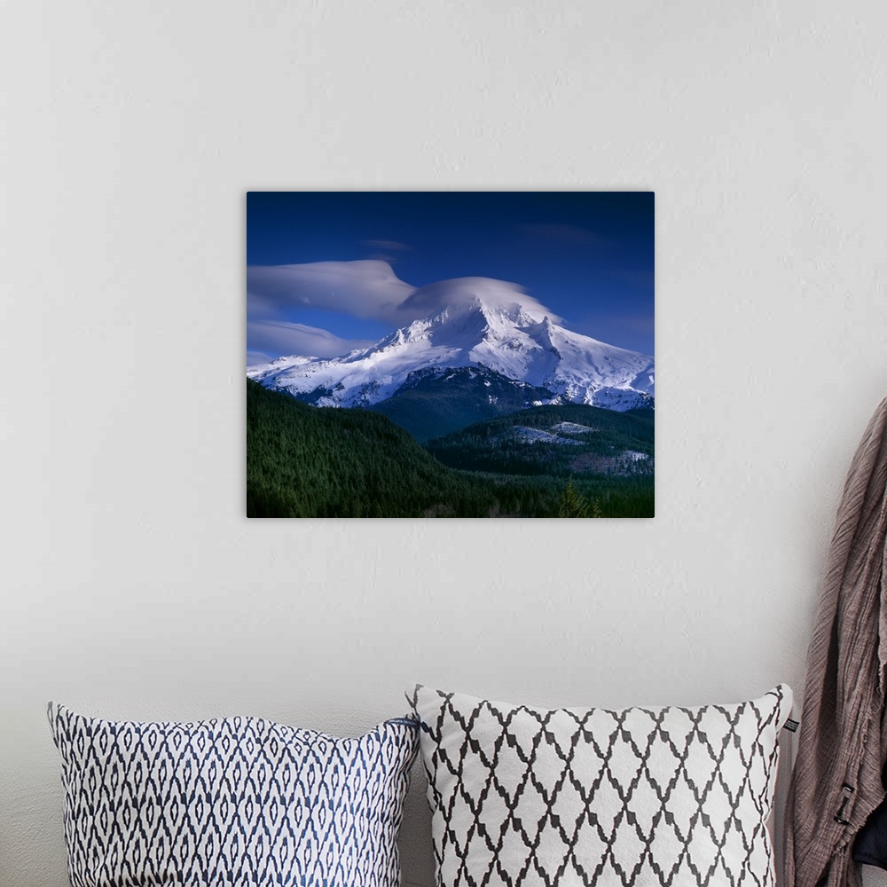 A bohemian room featuring Clouds covering the peak of Mount Hood in Oregon.
