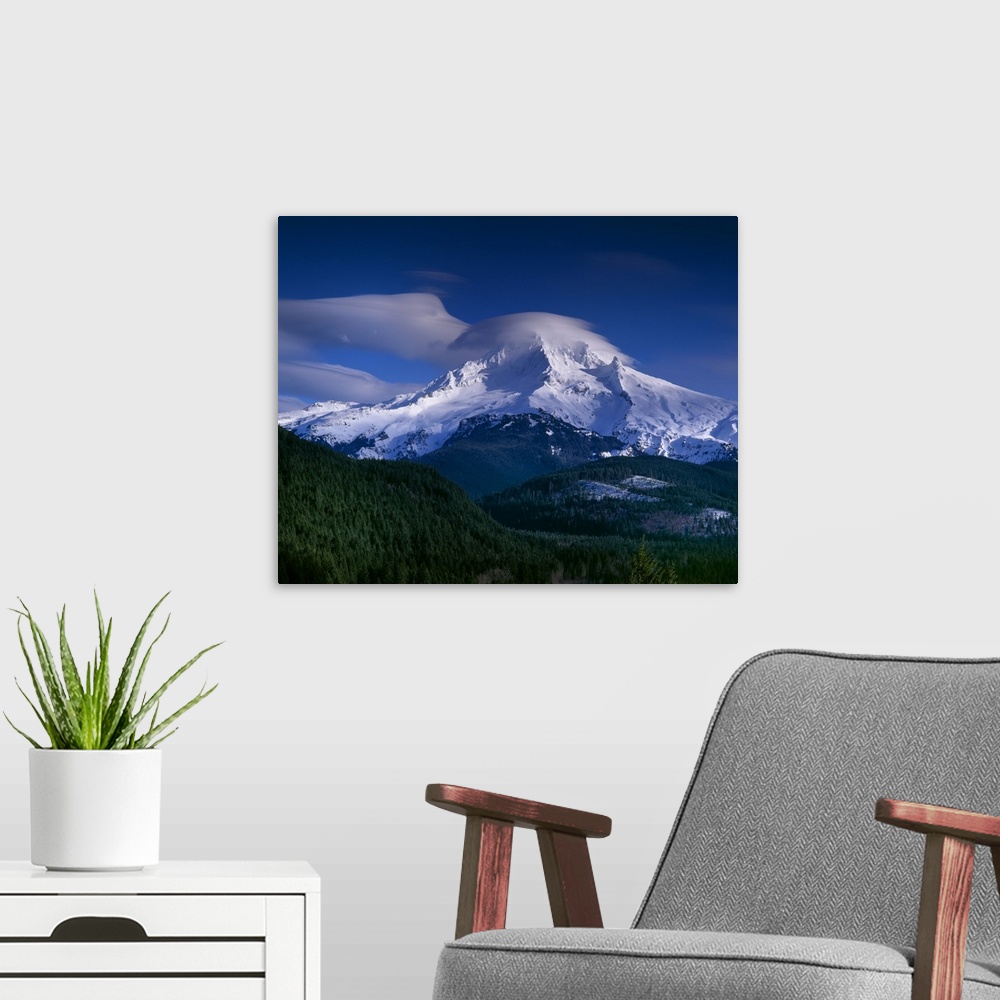 A modern room featuring Clouds covering the peak of Mount Hood in Oregon.