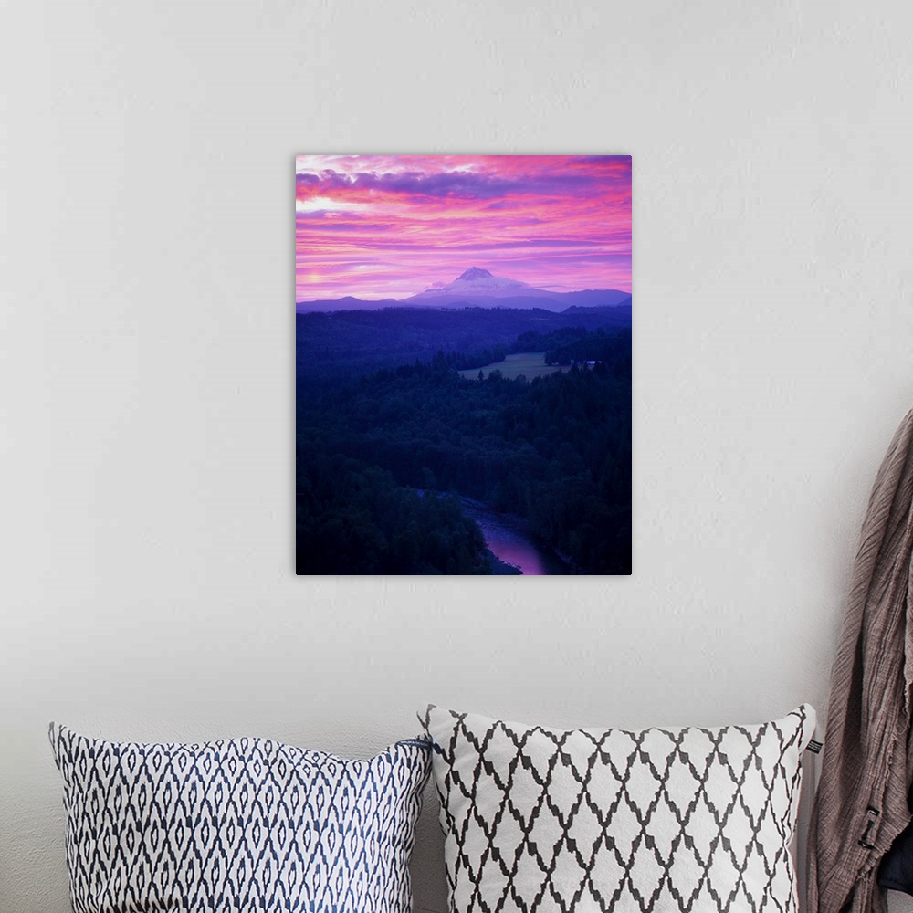A bohemian room featuring Purple clouds at sunset over Mount Hood covered in fog in the distance.