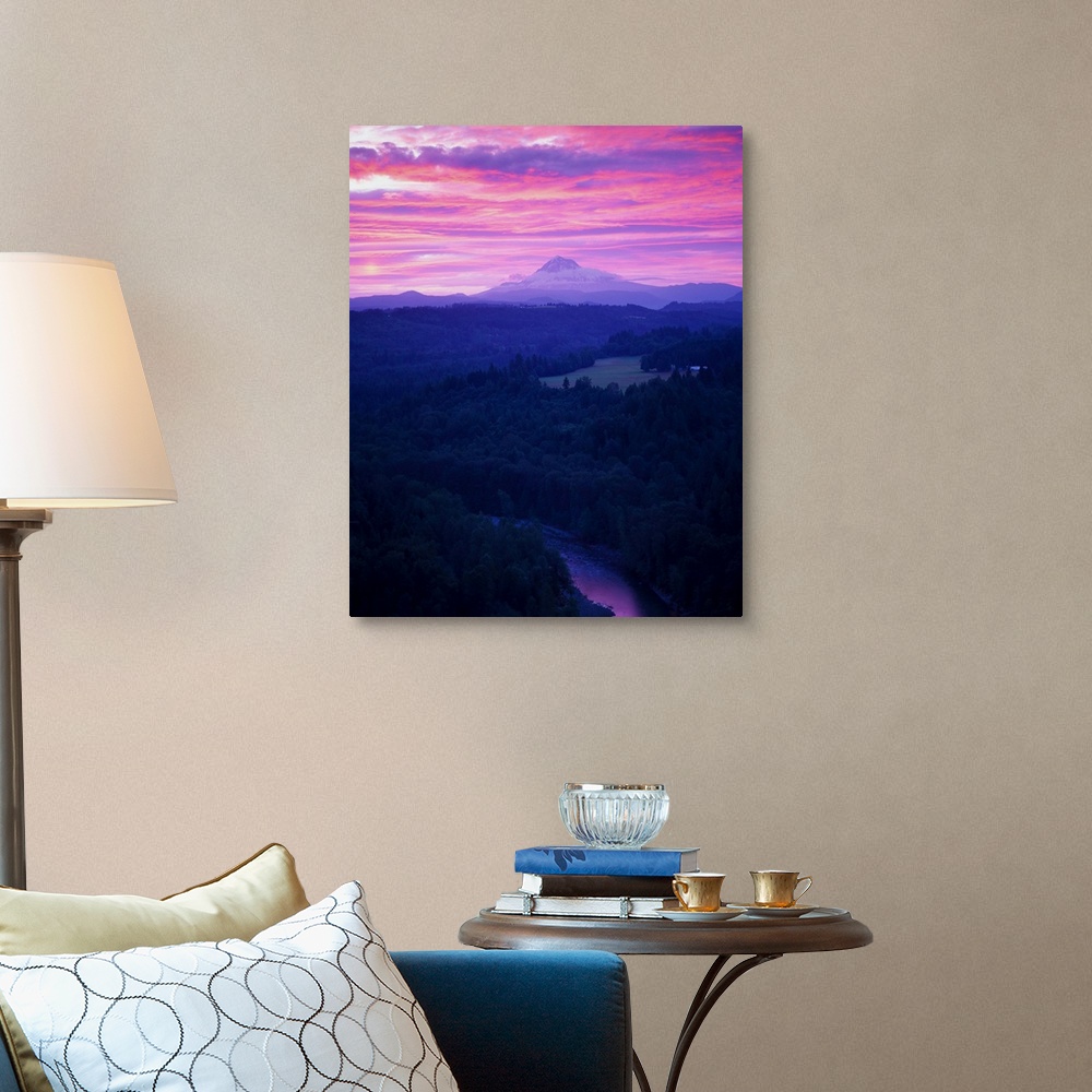 A traditional room featuring Purple clouds at sunset over Mount Hood covered in fog in the distance.