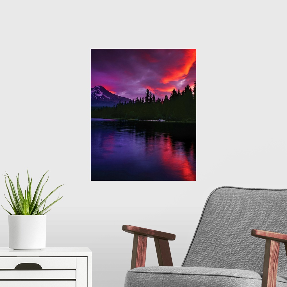 A modern room featuring Fiery sunset illuminating the clouds above Mount Hood.