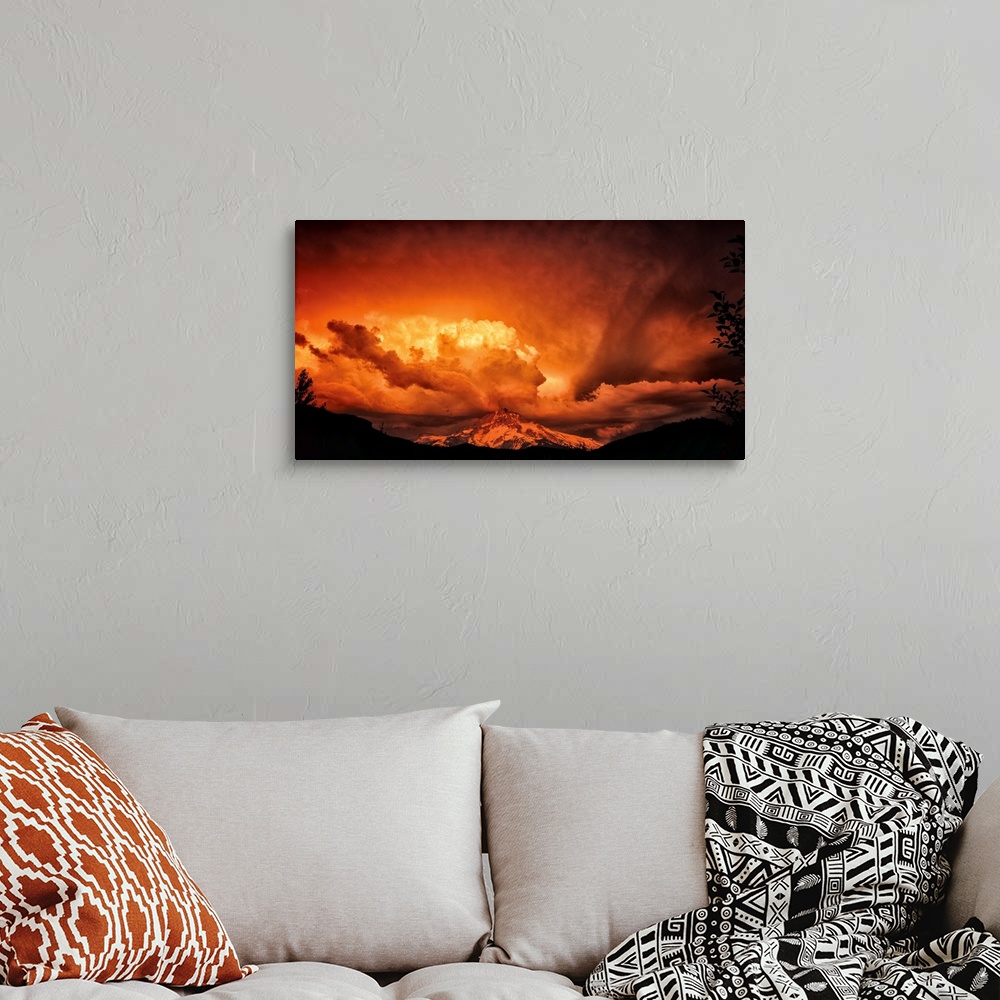 A bohemian room featuring Intense sunset colors in the clouds over Mount Hood.