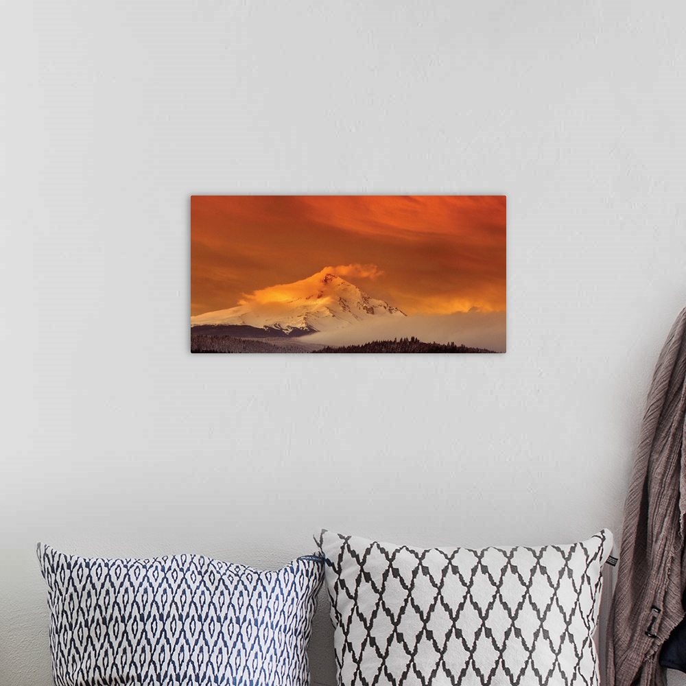 A bohemian room featuring Clouds covering the snowy peak of Mount Hood at sunset.
