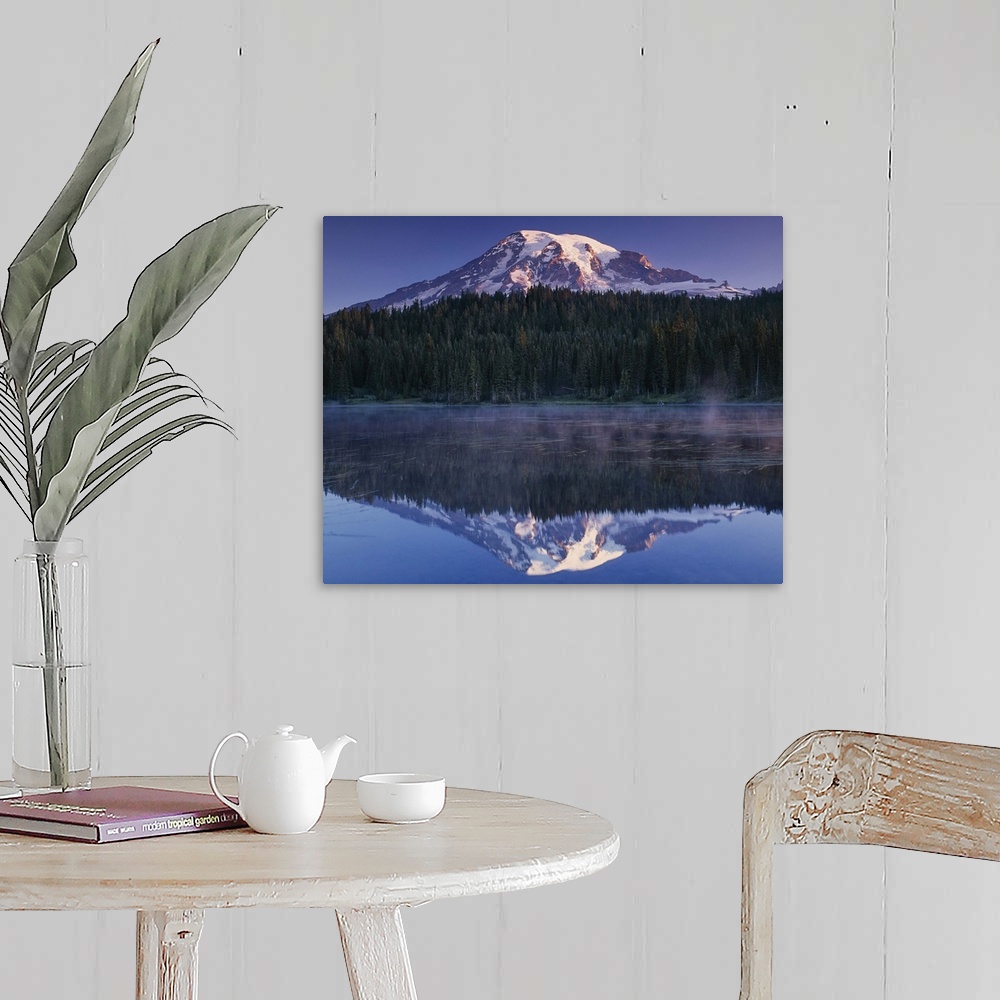 A farmhouse room featuring Mount Rainier and the surrounding forests reflected in a lake, Washington.