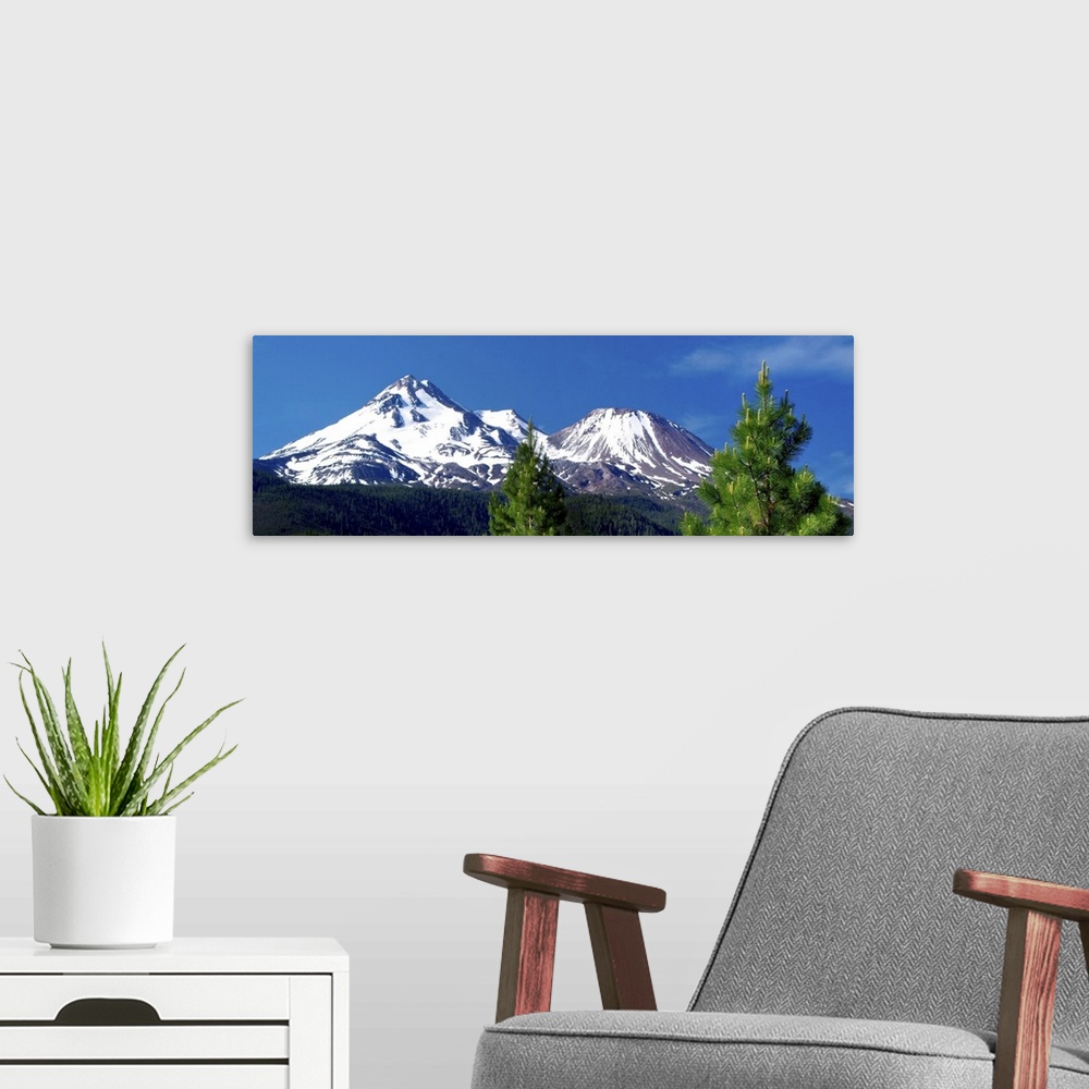 A modern room featuring Panoramic view of snow-capped Mount Shasta in California.
