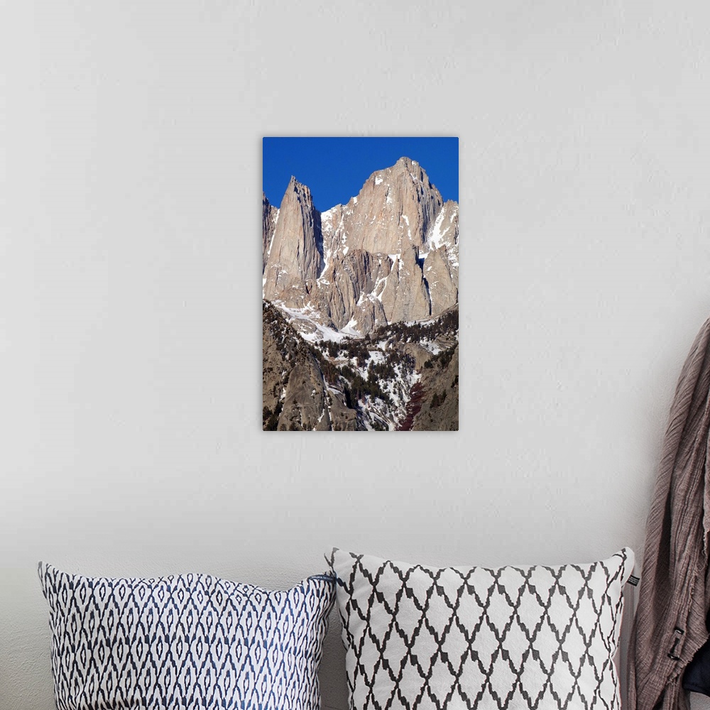 A bohemian room featuring Photograph of Mount Whitney's sharp and rocky peaks.
