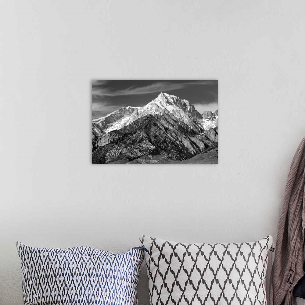 A bohemian room featuring Black and white photograph of Mount Williamson with snowy peaks.