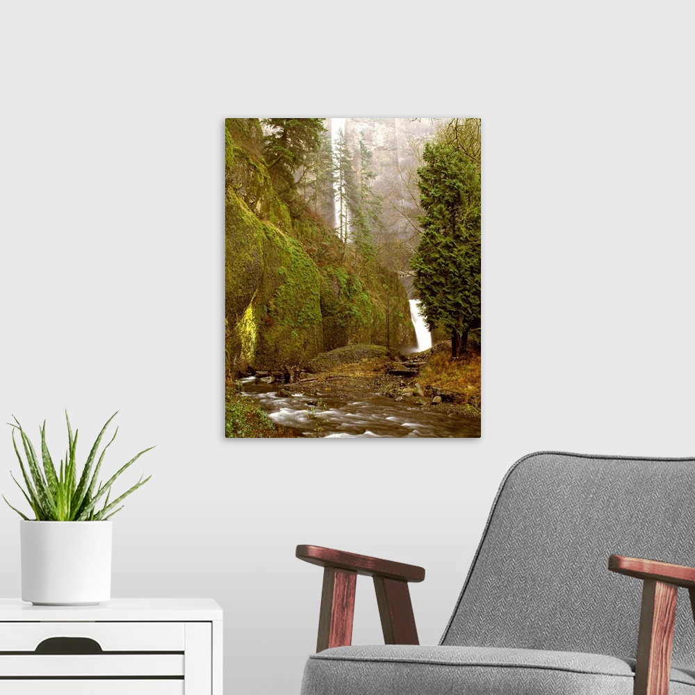 A modern room featuring Landscape photograph with Multnomah Falls in the background and a rushing creek in the forground,...