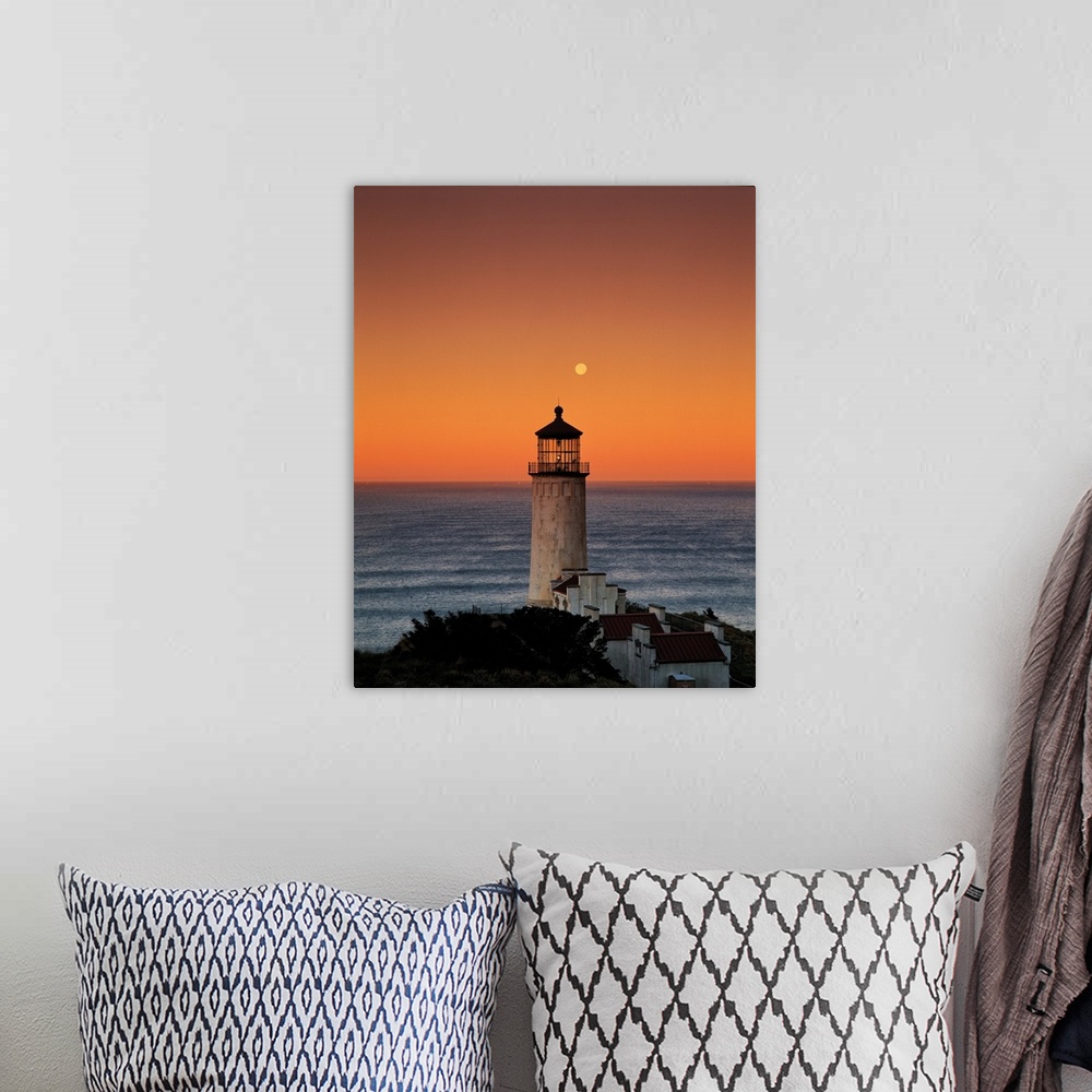 A bohemian room featuring A lighthouse overlooking the ocean at sunset, Washington.
