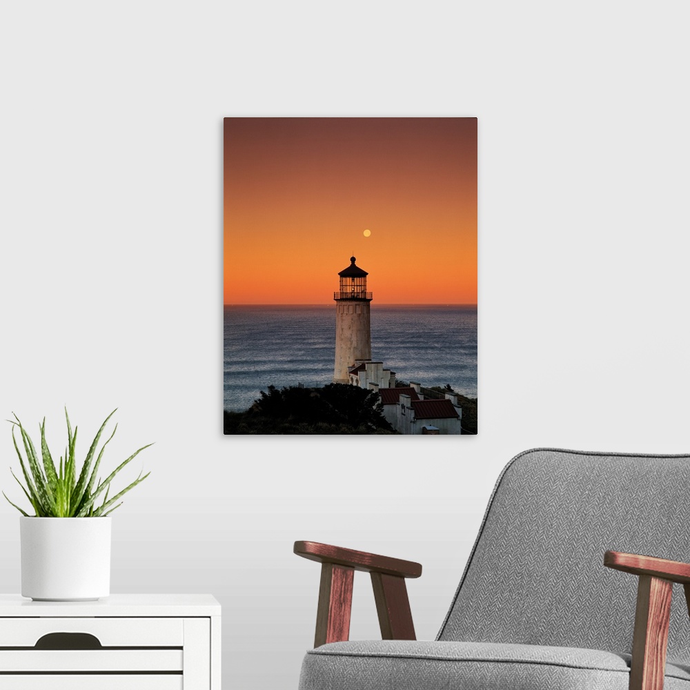 A modern room featuring A lighthouse overlooking the ocean at sunset, Washington.