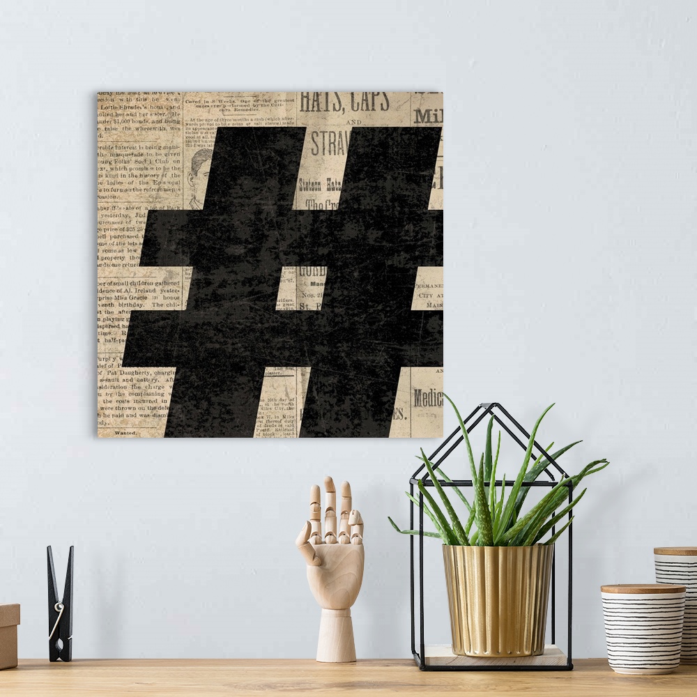 A bohemian room featuring Square decor with a large black number sign on a newspaper background.