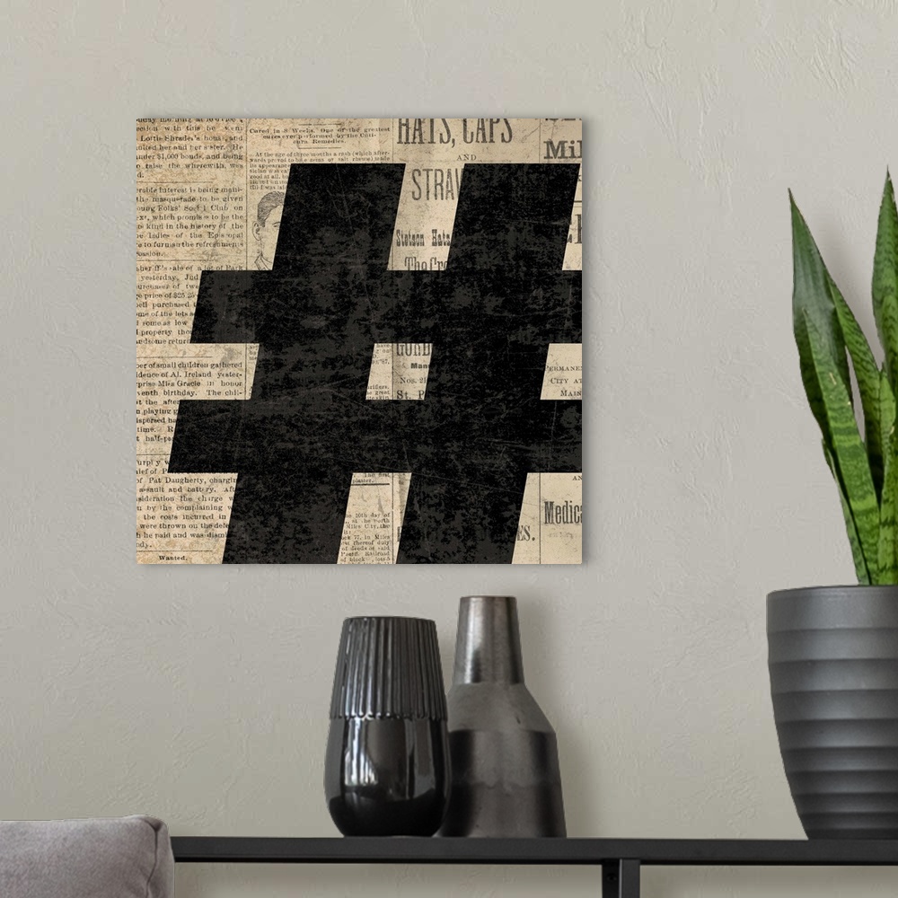 A modern room featuring Square decor with a large black number sign on a newspaper background.