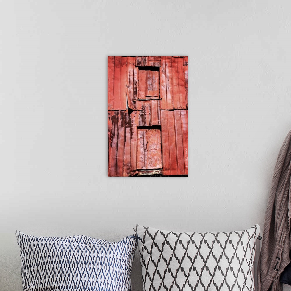A bohemian room featuring Photograph of a weathered farm building, taking up the whole frame.